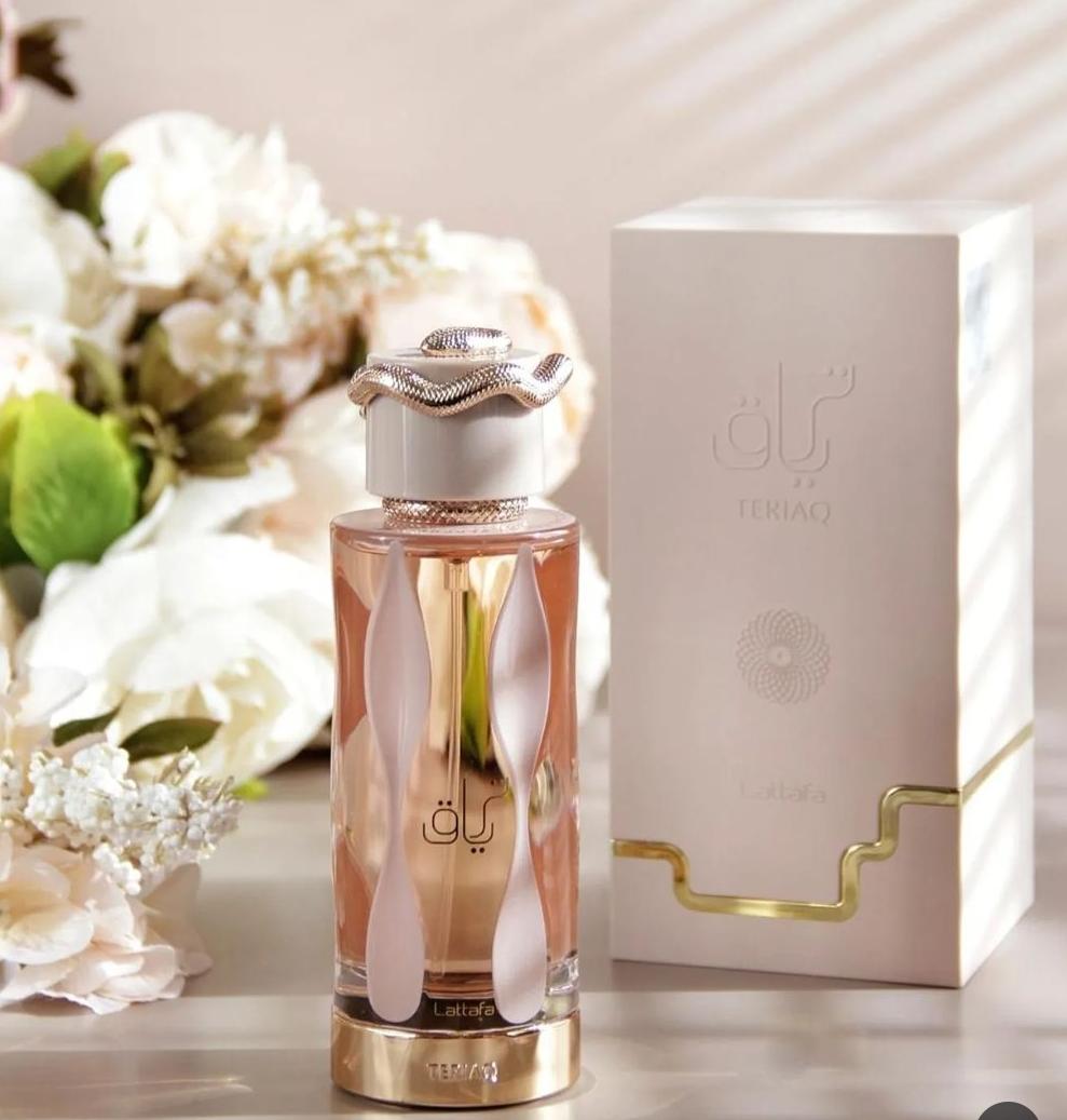 Lattafa Teriaq damparfym i vacker flaska med detaljhandtag och elegant förpackning